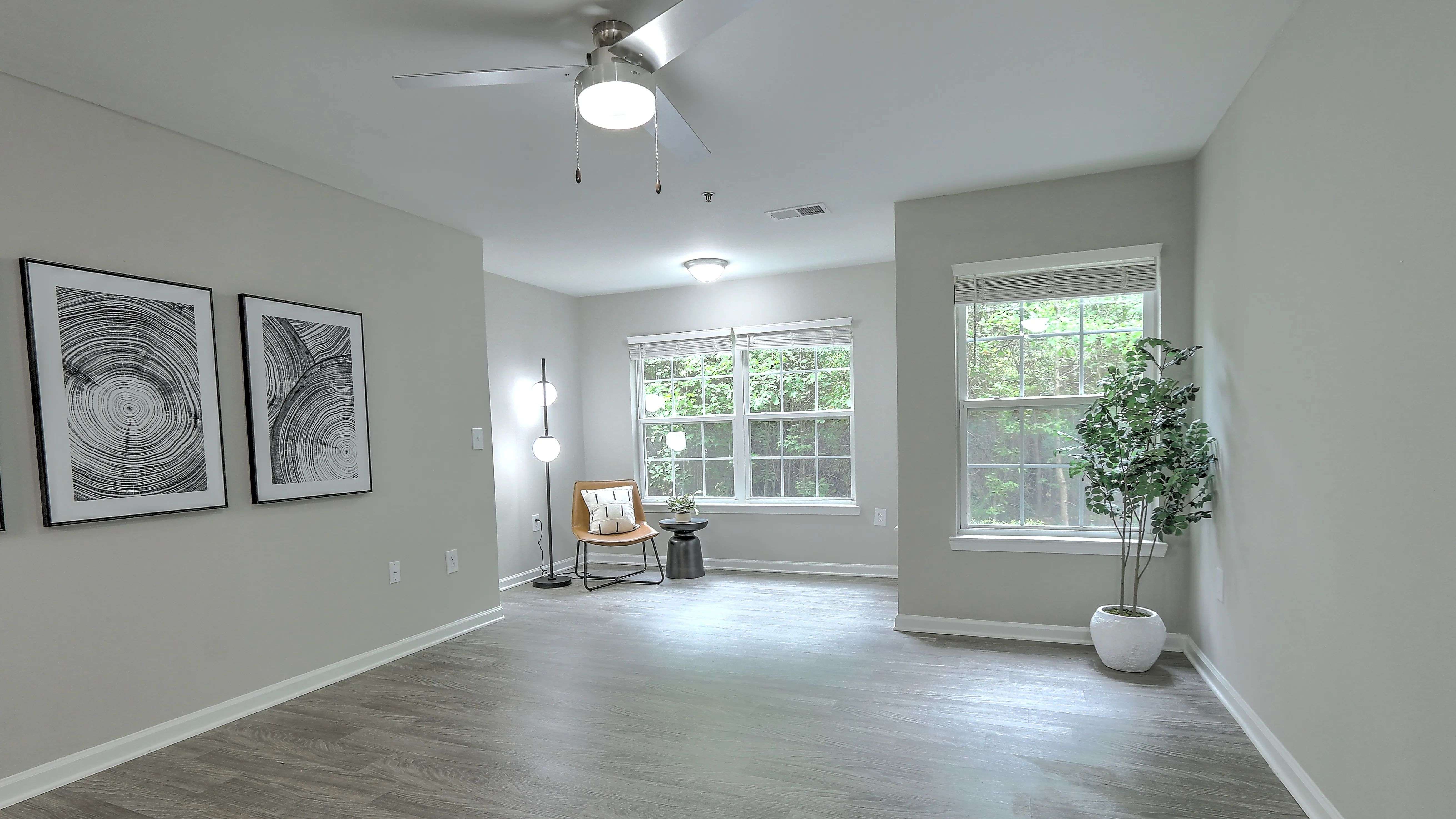 Spacious living room with a dedicated area for an at-home office or a reading nook.