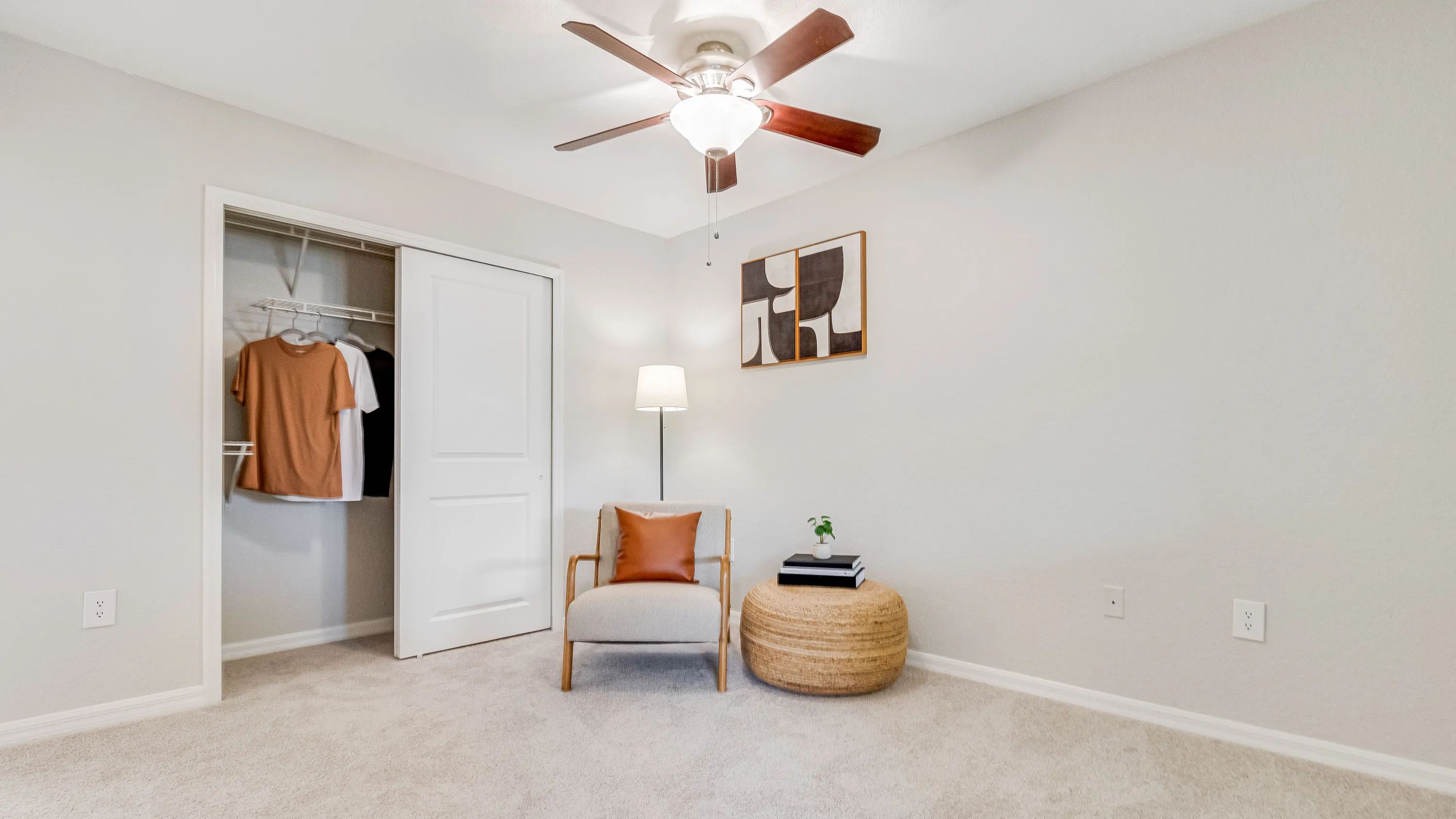 Experience the joy of spacious bedrooms featuring built-in shelving and refreshing ceiling fans, creating an oasis of luxury and comfort. 