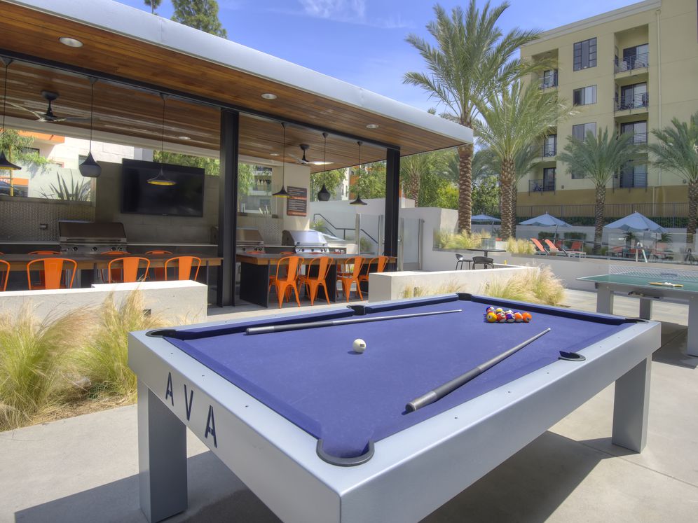 Outdoor Kitchen with Grills and Game Tables