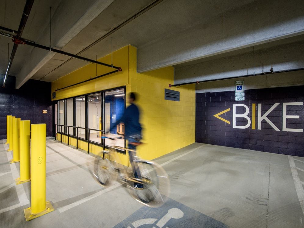 Parking garage with bike repair room