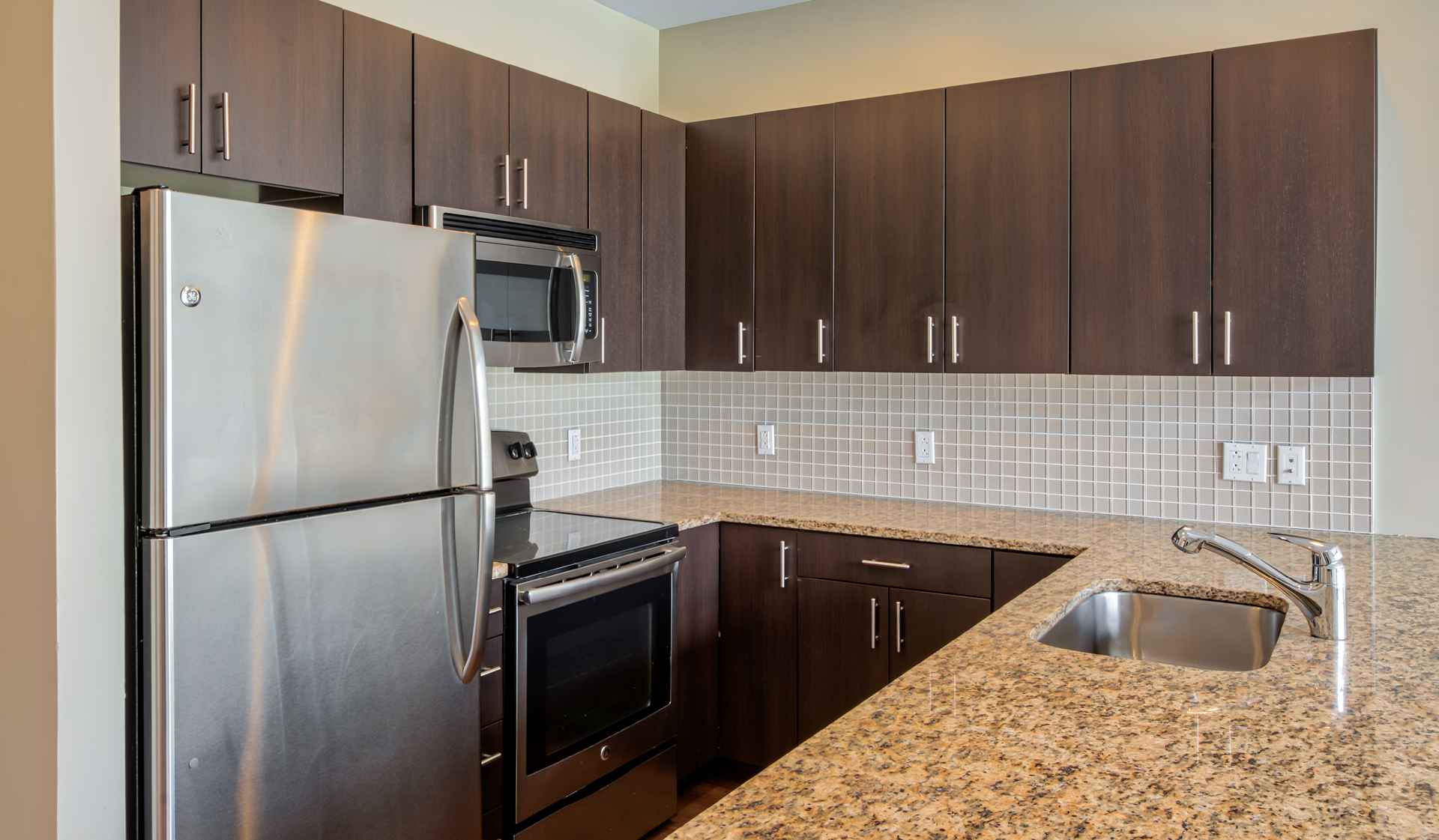 Modern kitchens with stainless steel appliances and granite countertops