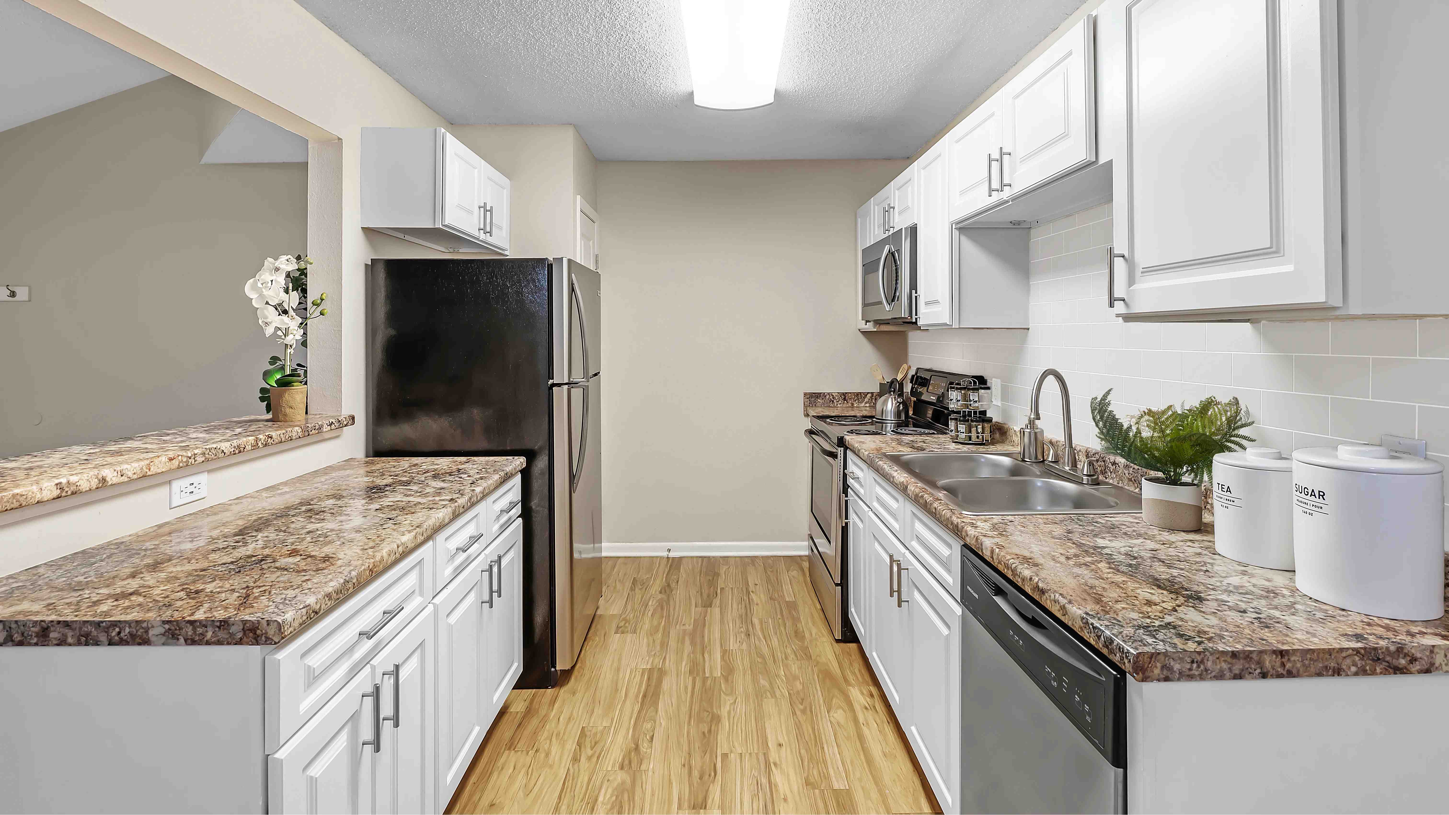 Savor the elegance of our spacious galley kitchens boasting ample cabinetry and abundant counterspace.