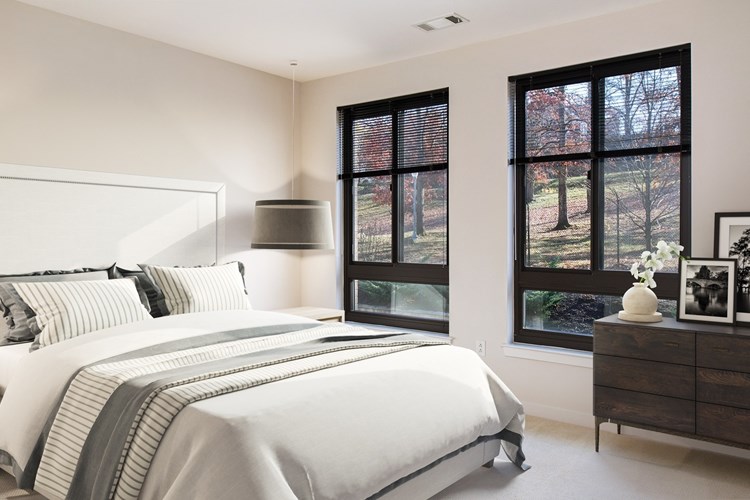 Spacious bedrooms with large windows providing ample natural light