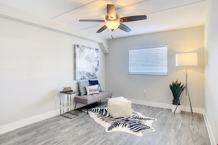 Spacious bedrooms featuring wood-style flooring and spacious closets.