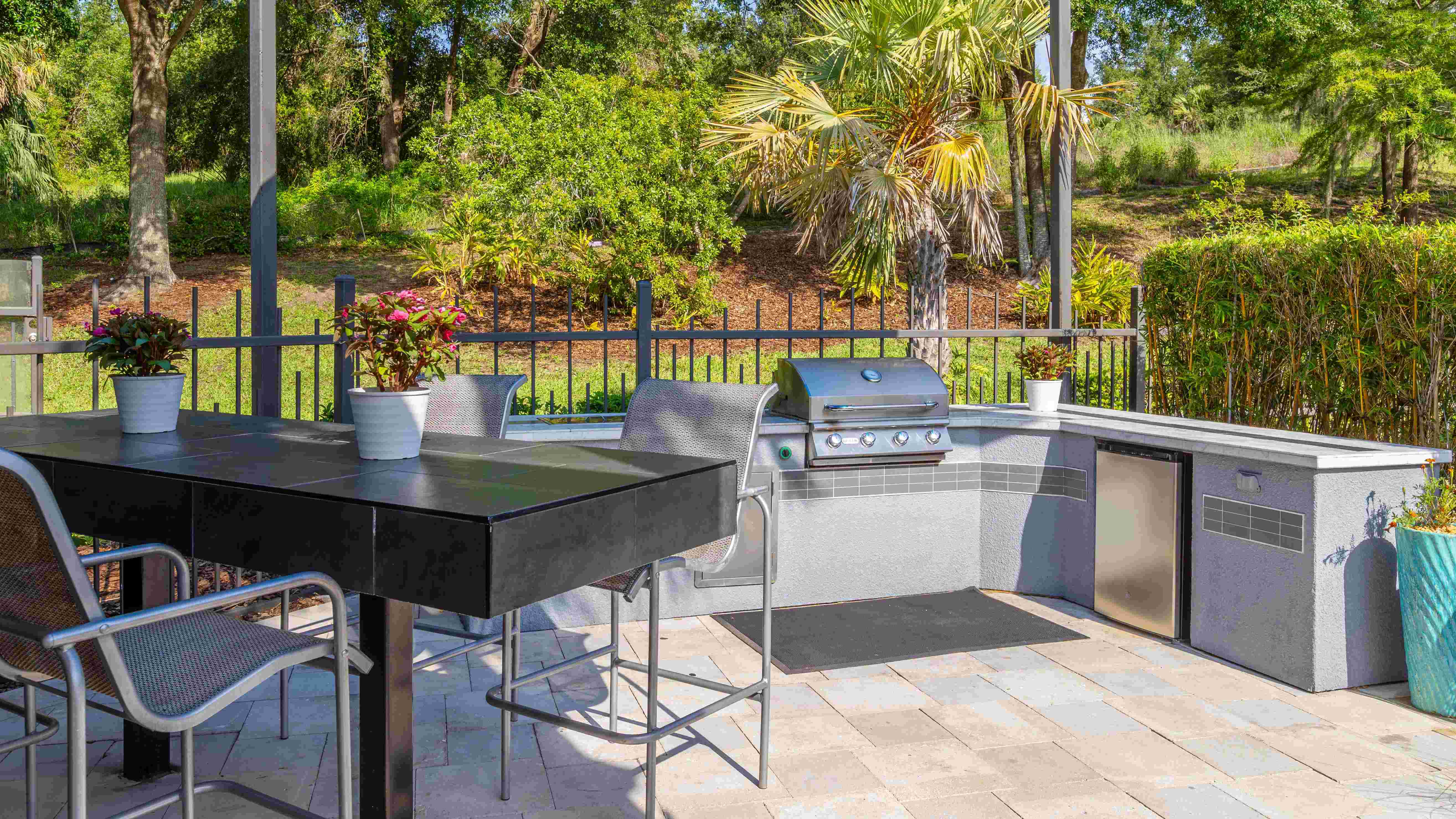 Cook, entertain, and unwind—this sleek outdoor kitchen is your go-to spot for summer BBQs and casual poolside dining.
