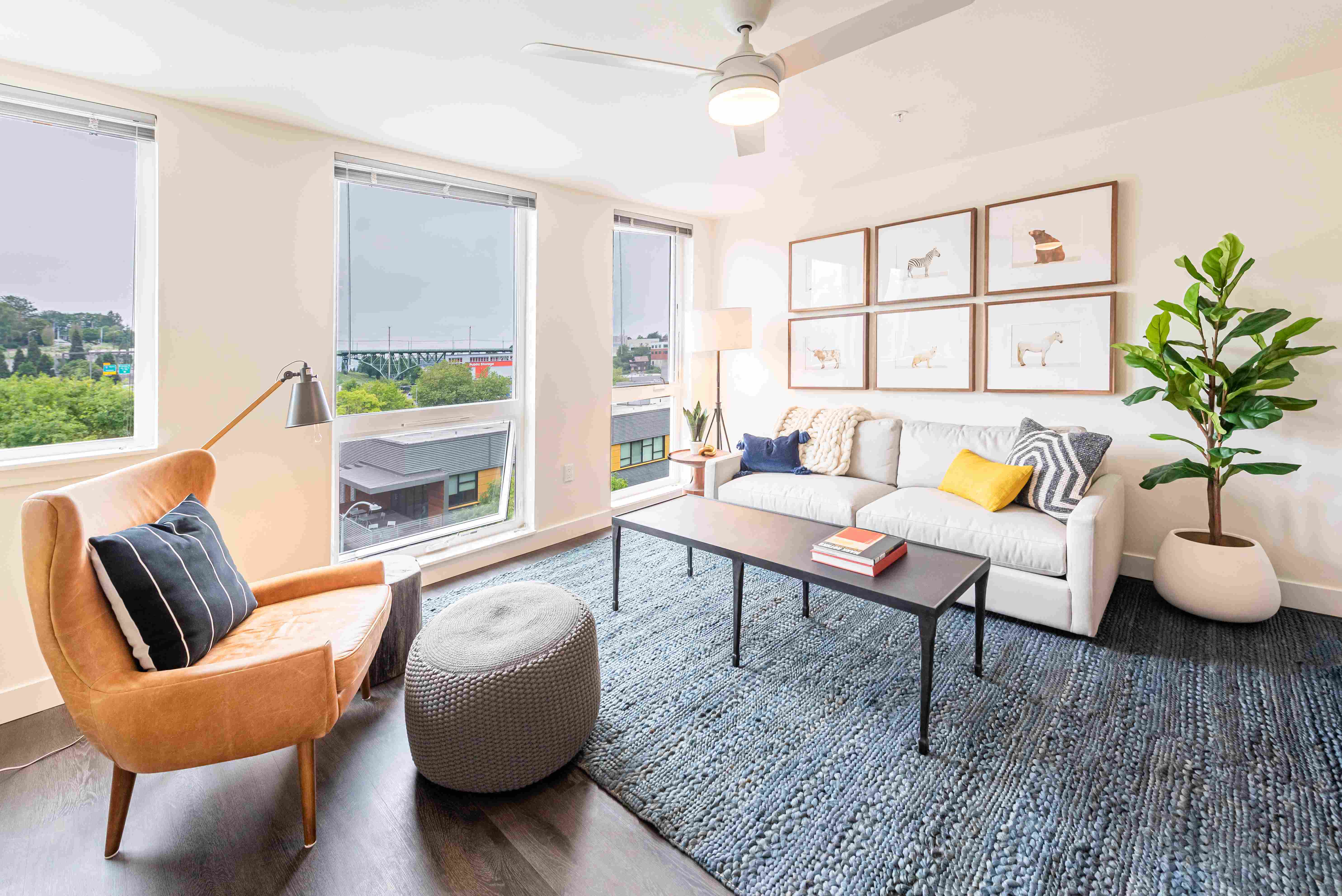 Living Room with Floor to Ceiling Windows, Ceiling Fan, and Spacious Layout
