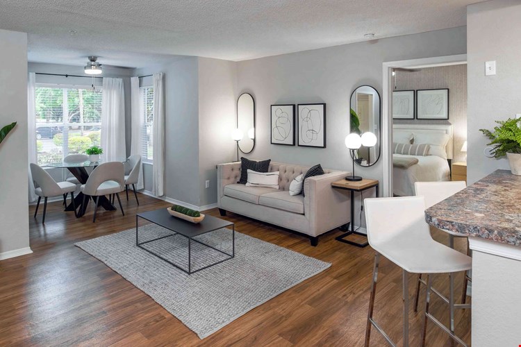 This thoughtfully designed living room flows effortlessly into the solarium, creating a light-filled space perfect for both entertaining and relaxing.