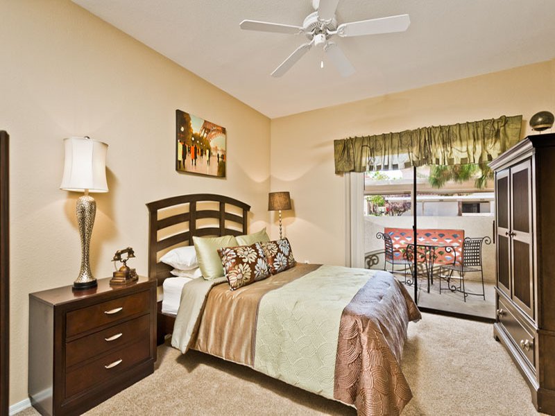 Master bedroom with large walk-in closet and patio access
