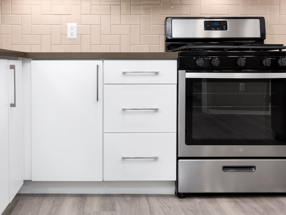 Newly renovated Design Scheme I kitchen with tile backsplash