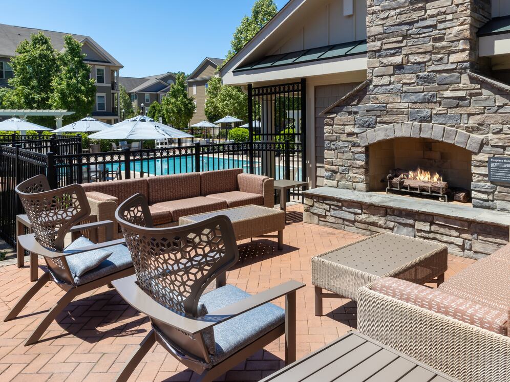 Courtyard with lounge seating and a fireplace