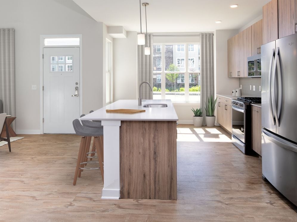 Upgrade Scheme townhome kitchen and dining areas with hard surface flooring