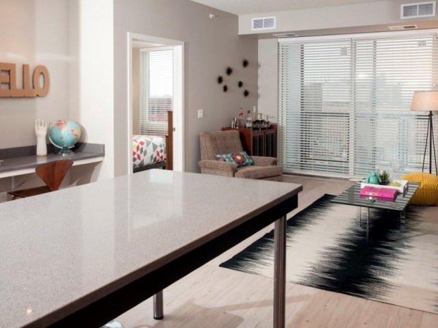 Living Room with Built In Quartz Tech Desk