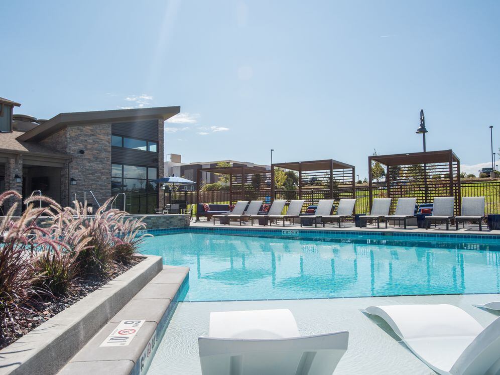 Swimming pool and sundeck with lounge seating