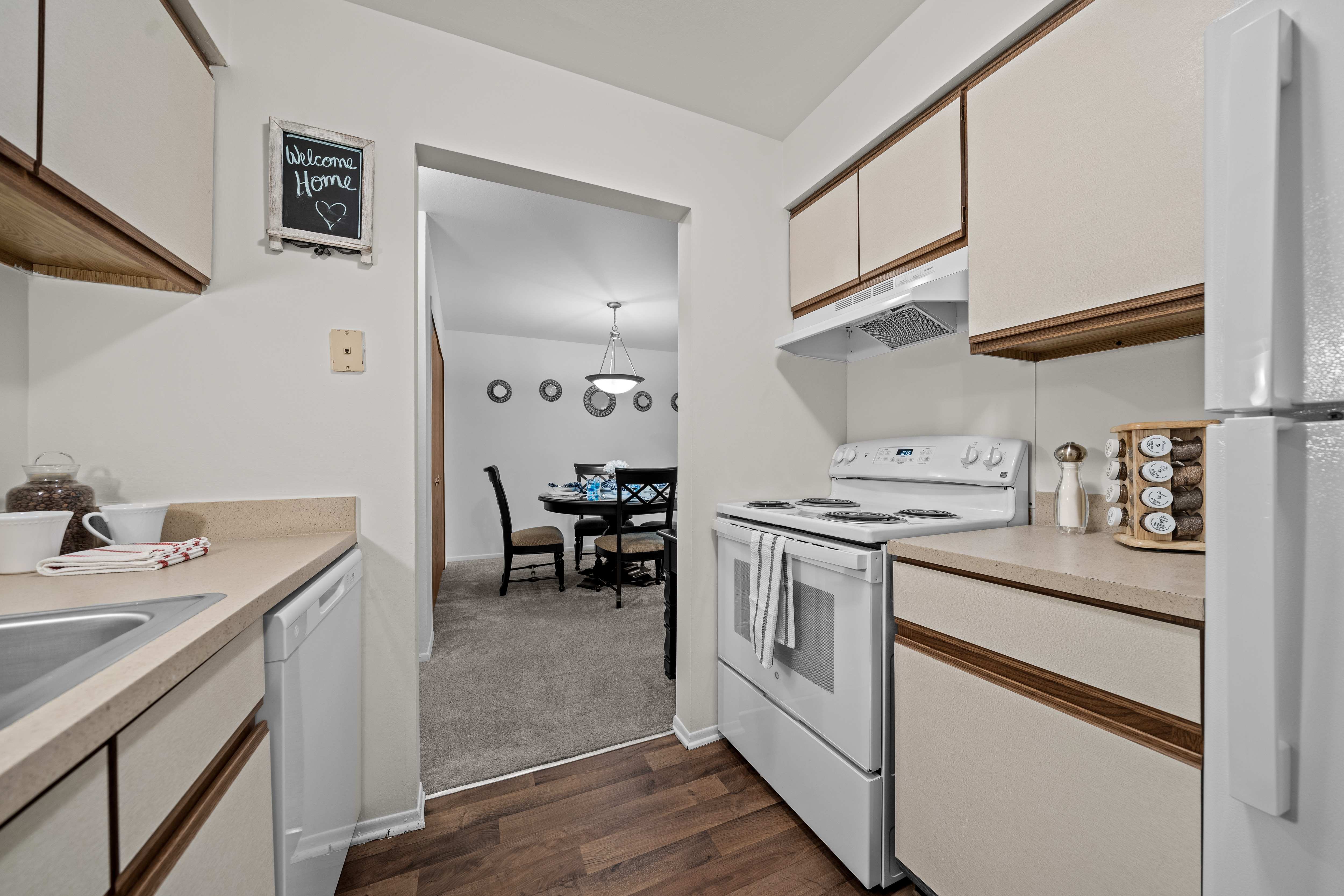 Cozy dining room connected to kitchen at Westwood Village Apartments in Westland, MI