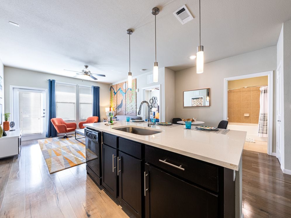 Kitchen, living, and dining area with hard surface flooring