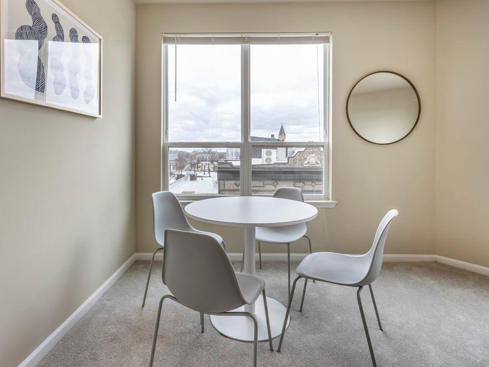 Furnished+ apartment homes include a dining set (Representative Image – exact items and style of furnishings may vary)