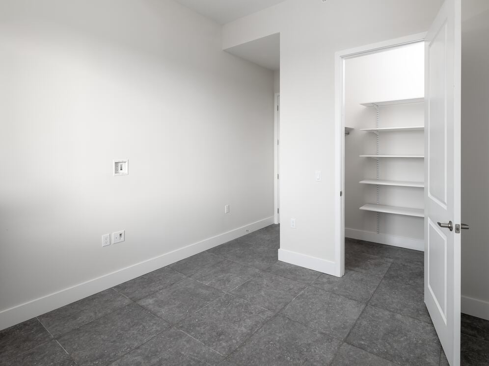 Signature Collection Three-bedroom apartment with custom closet shelving system