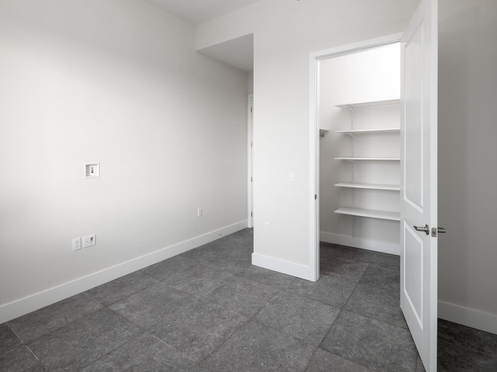 Signature Collection Three-bedroom apartment with custom closet shelving system