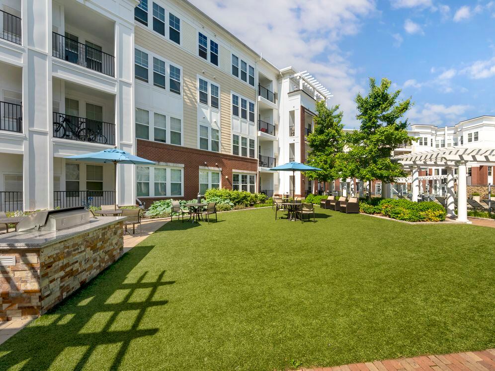 Courtyard with barbecue grill and dining area