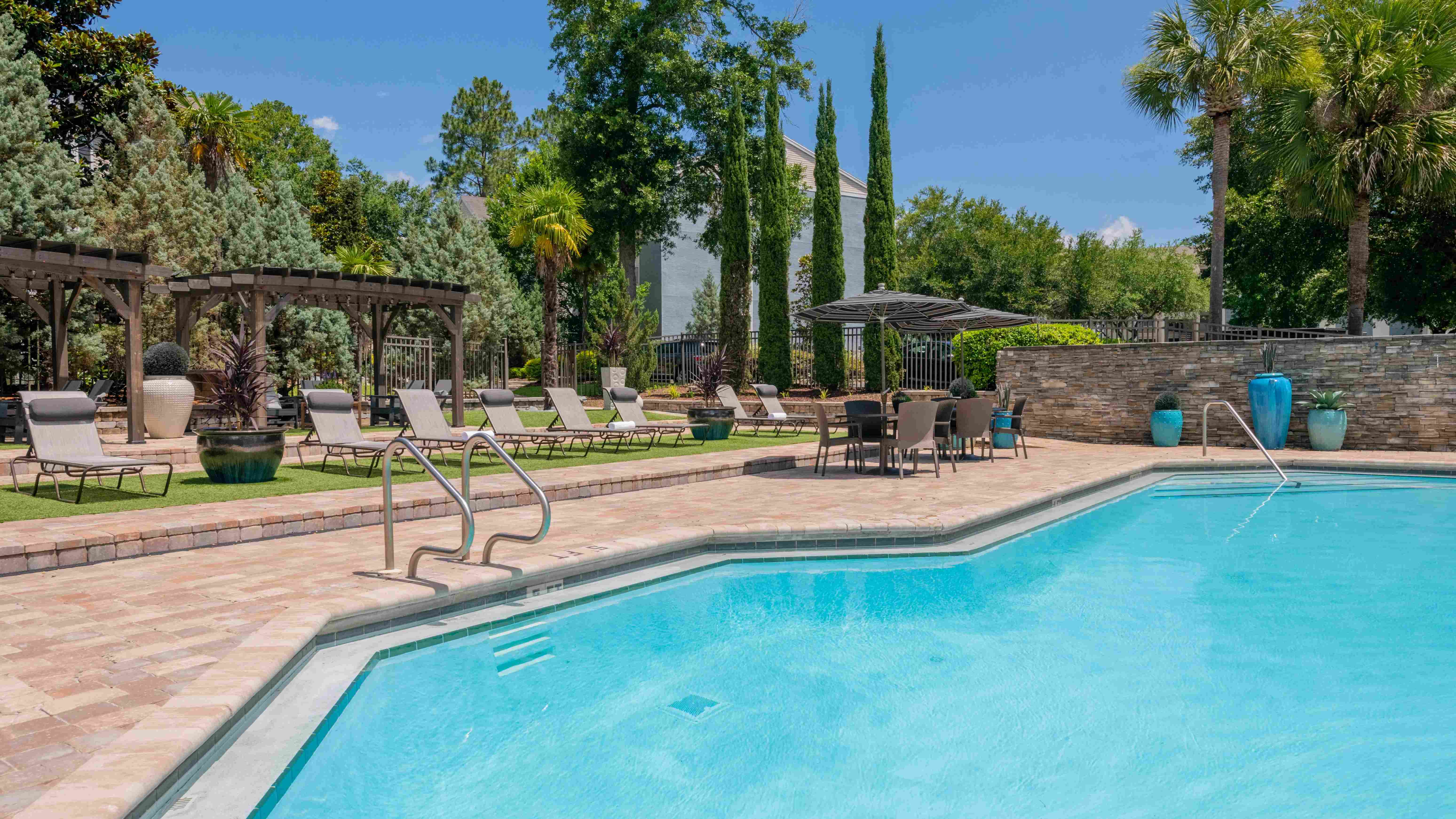 Our radiant poolside oasis invites relaxation under the Florida sun. 