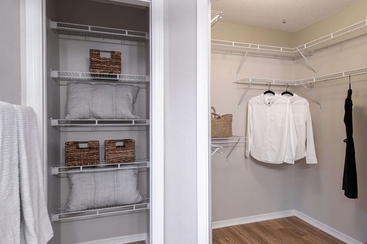 Directly accessible from the master bathroom, this walk-in closet offers tons of shelving and storage space to keep everything neat and organized.