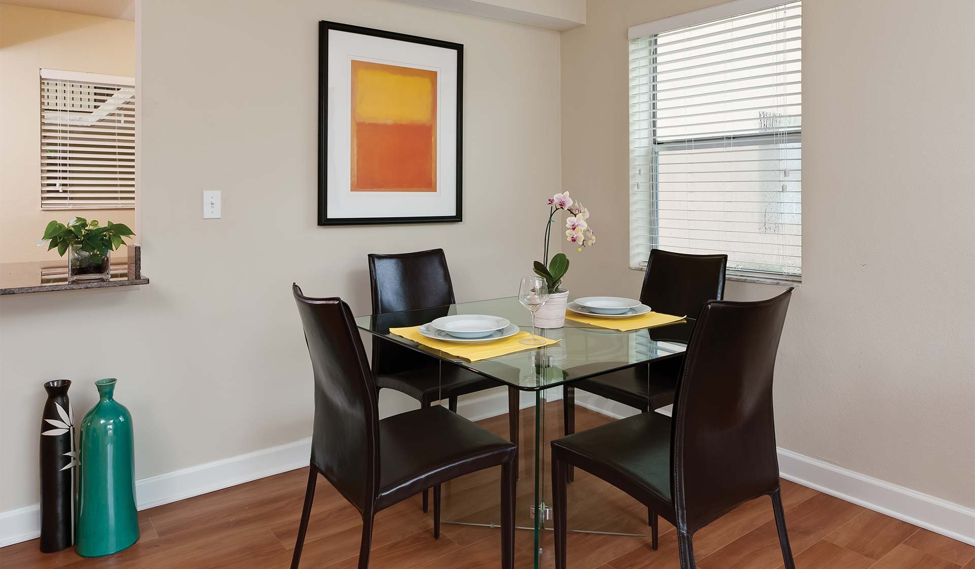 Separate dining area with wood flooring