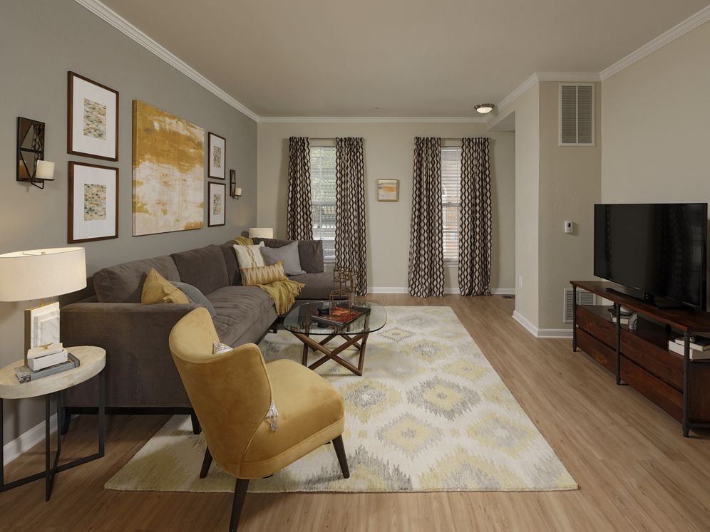 Espresso Finish Package townhome bedroom with carpet and accent wall