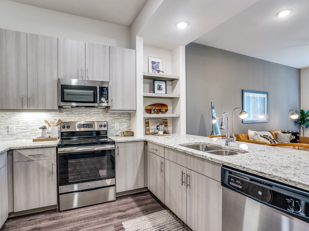 Gray finish package kitchen and dining area with hard surface flooring.