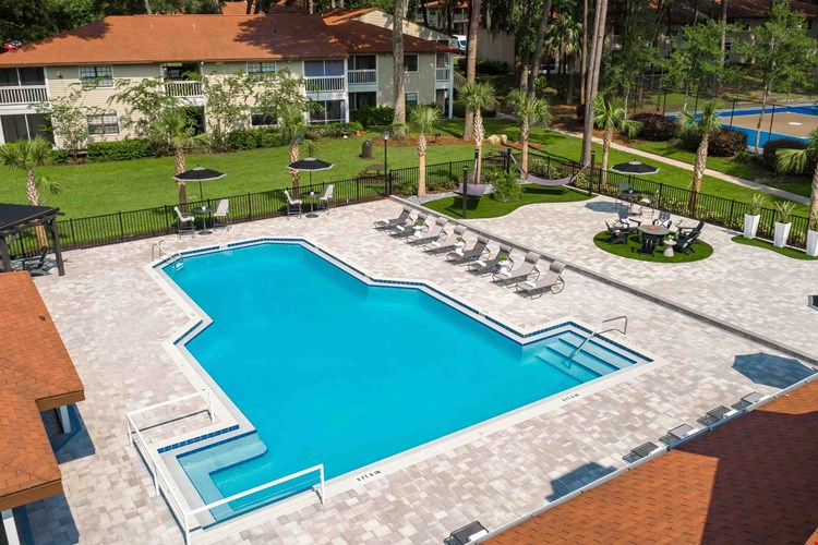 An enchanting aerial view of our resort-style pool and expansive sundeck, promising endless fun.