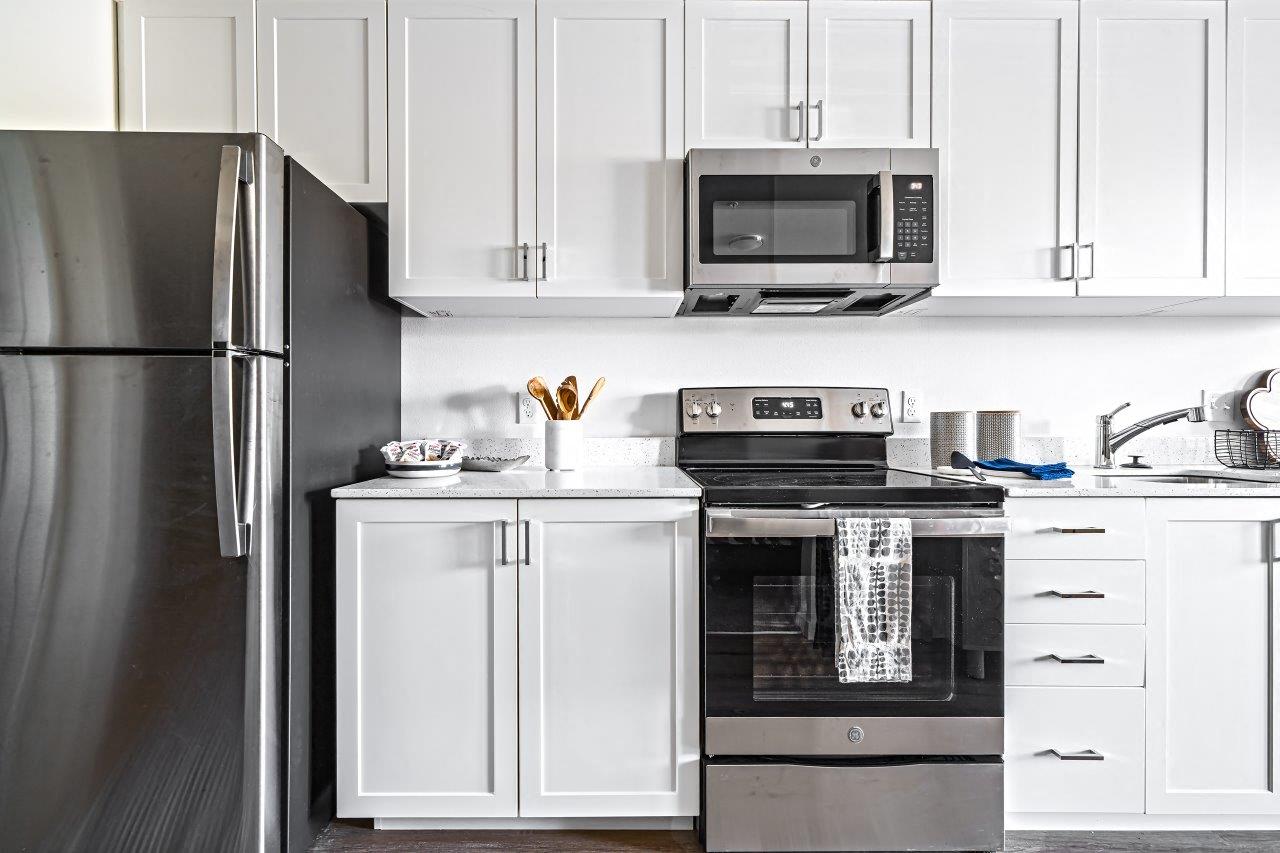 Bright kitchens featuring stainless steel appliances