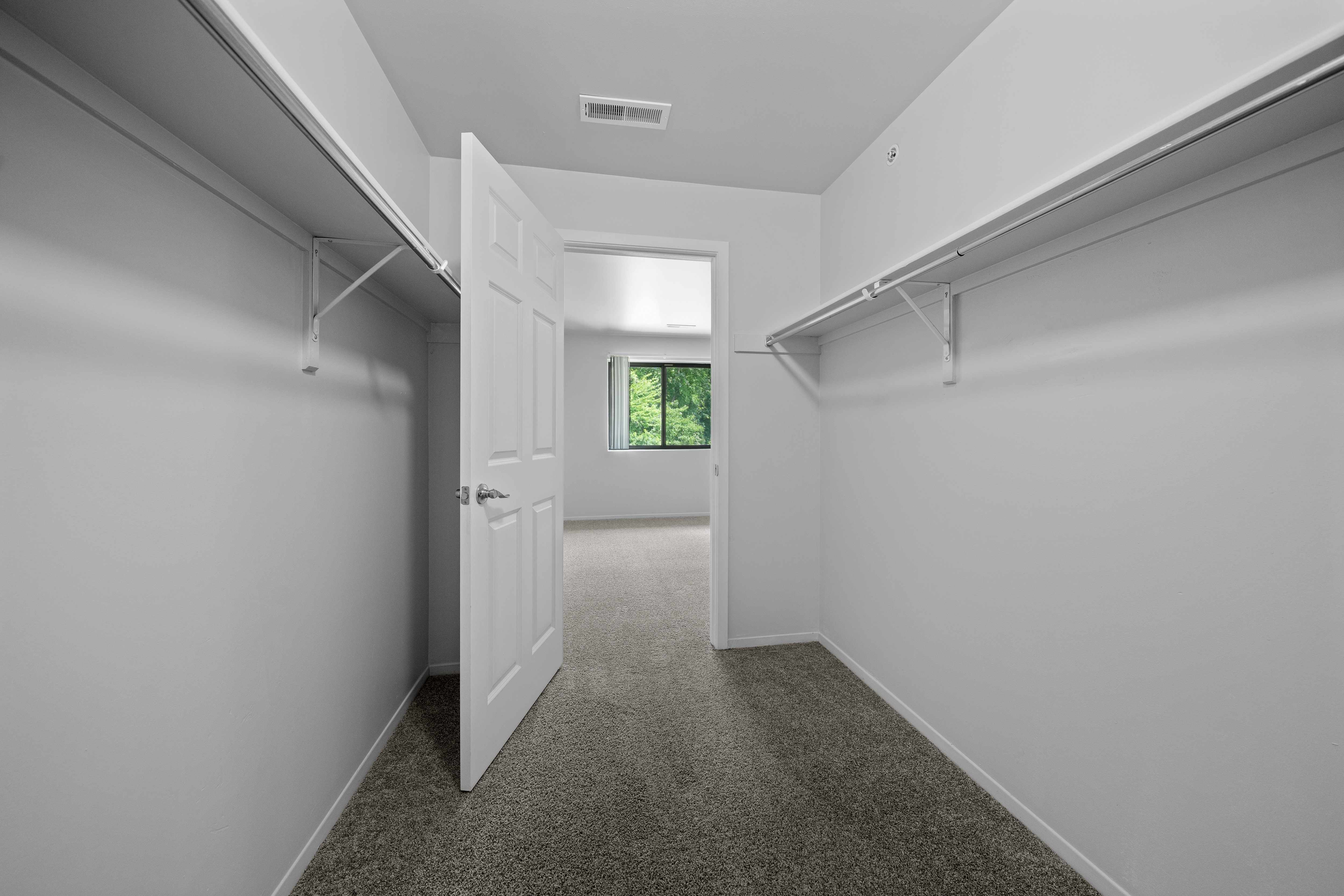 Spacious bedroom closet for ample storage at Woodland Villa Apartments in Westland, MI.