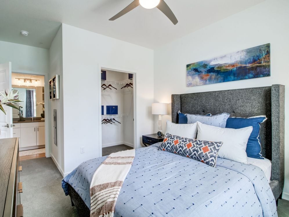 Bedroom with ceiling fan and carpeted flooring