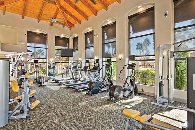 24-hour fitness center with TVs on all cardio equipment