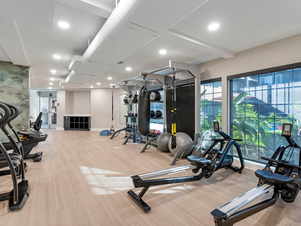 Fitness center with cardio and TRX equipment