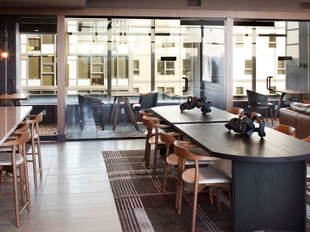 Resident lounge with coworking spaces and study pods