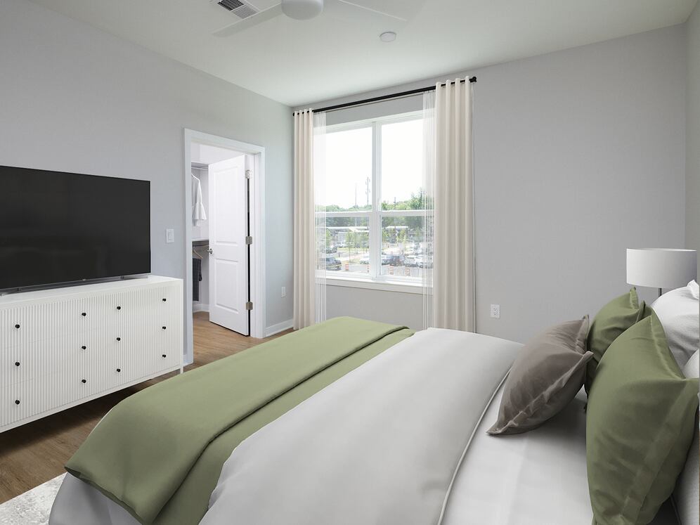 Signature Collection Primary bedroom with hard-surface vinyl plank flooring