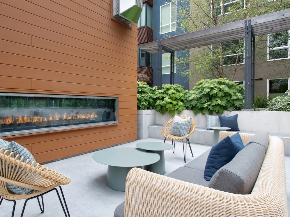 Outdoor resident lounge with common area seating and fireplace