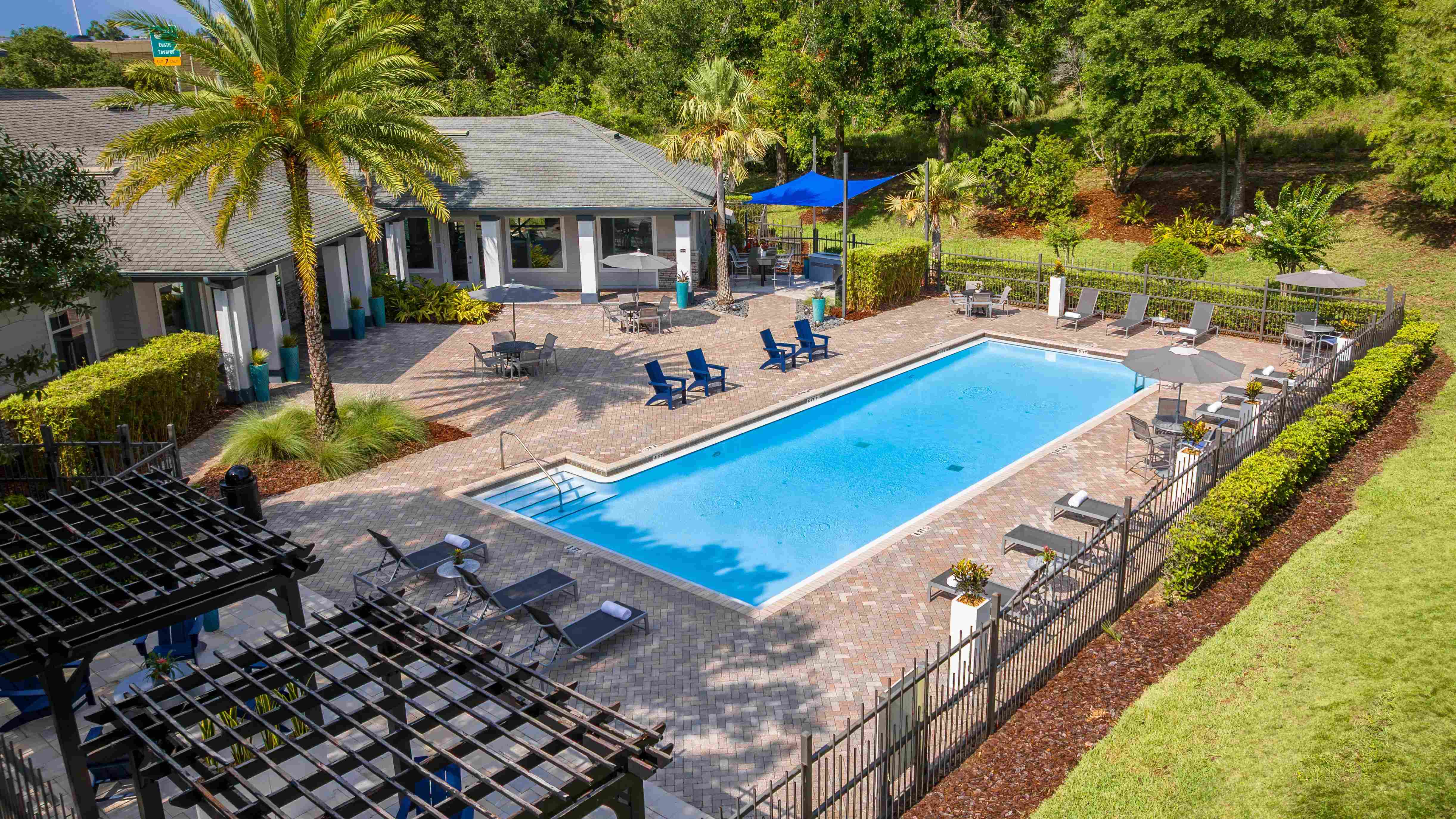 Surrounded by lush greenery and modern lounge seating, the Elevate 155 pool offers the ultimate space to relax, recharge, and soak up the Florida sunshine.