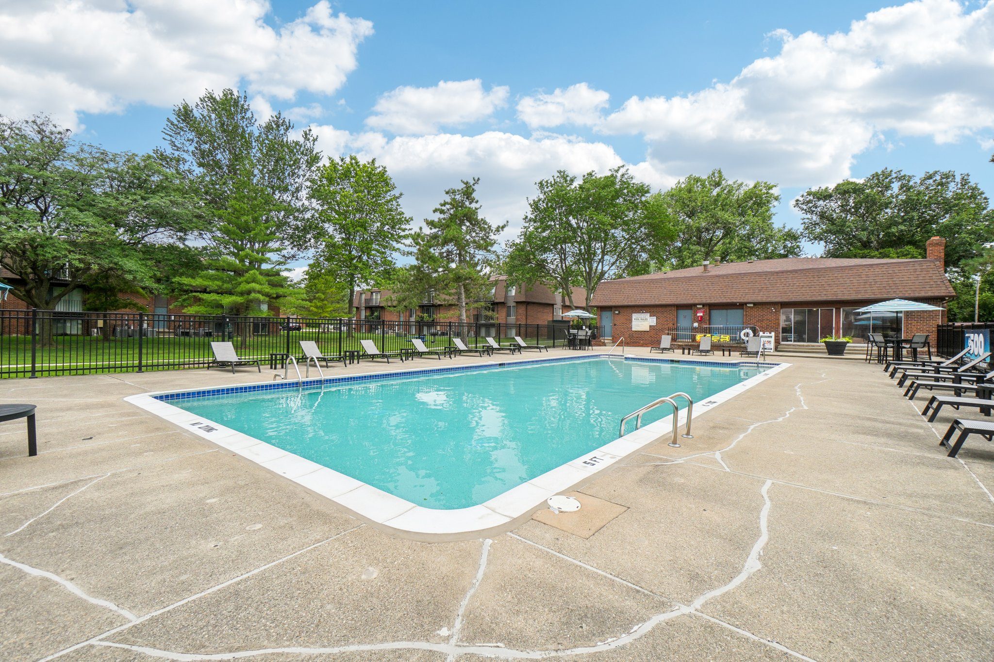 Heated pool and sundeck at Drawbridge Apartments in Harrison Township, MI.