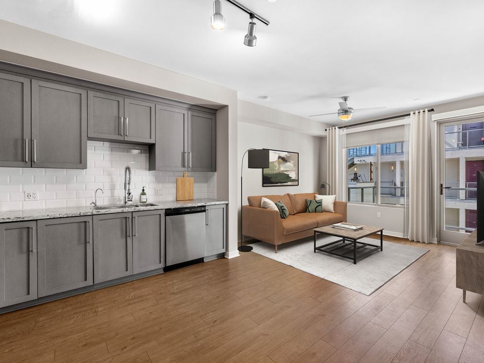 Kitchen, living, and dining area with hard surface flooring