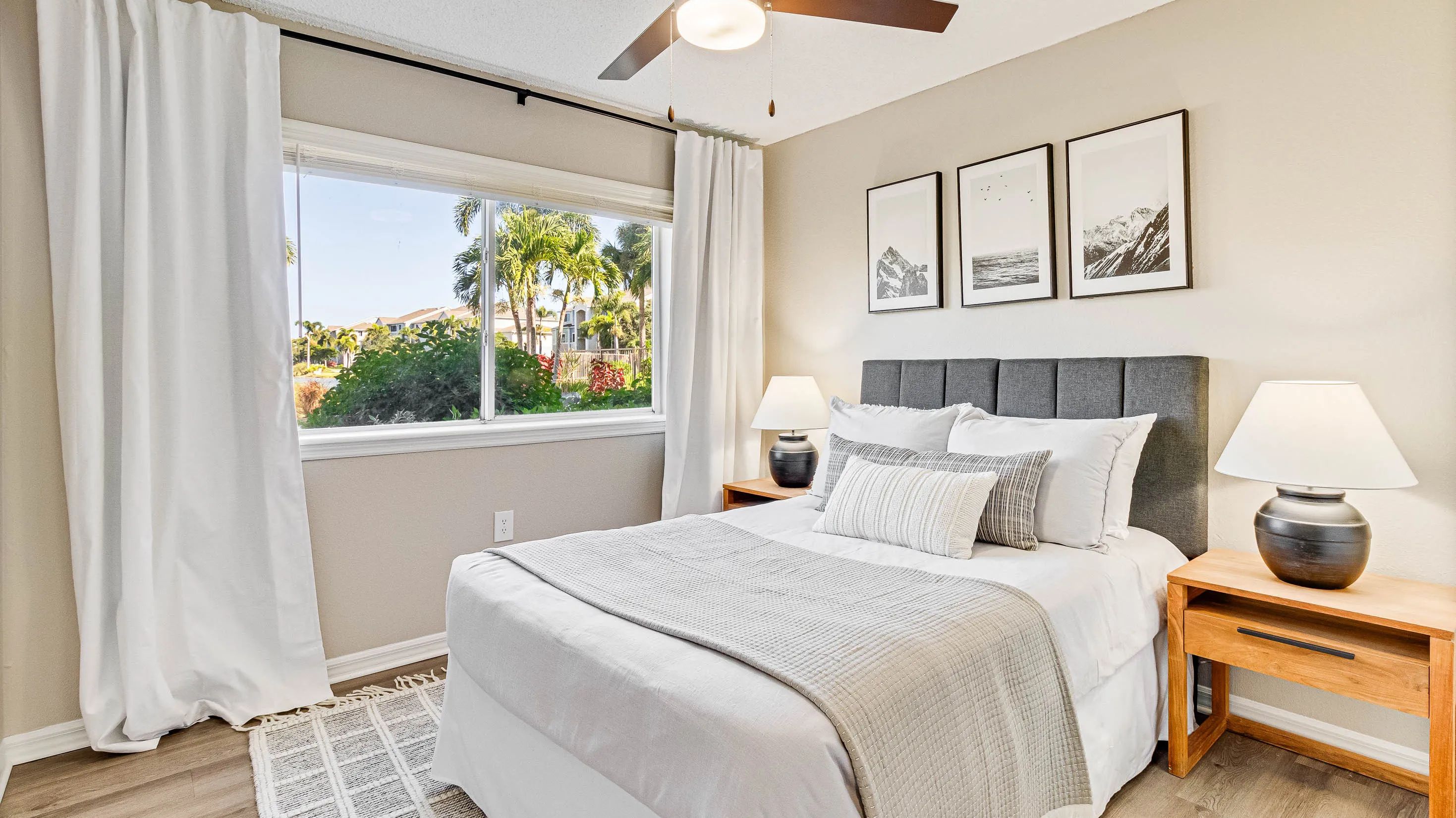 Spacious bedrooms with plush carpet or wood-style flooring and ceiling fans for ultimate comfort. 