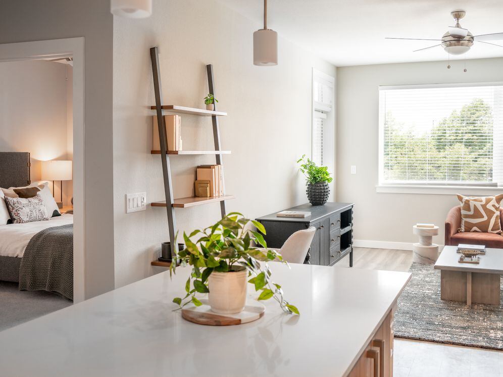 Living area with hard surface flooring and granite kitchen island