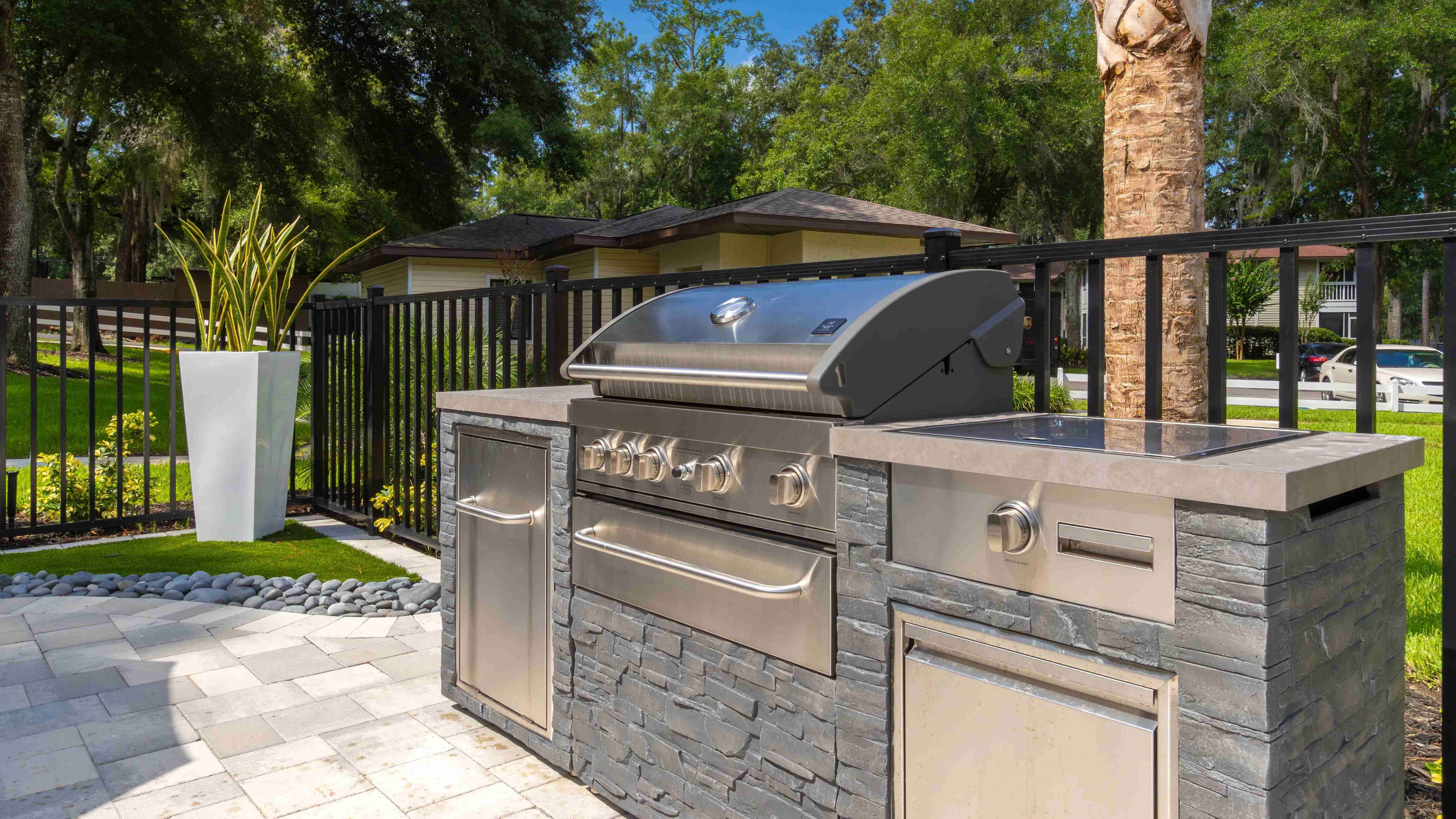 Fire up a delicious BBQ at our outdoor kitchen, boasting a stately gas grill for cookout fiestas.