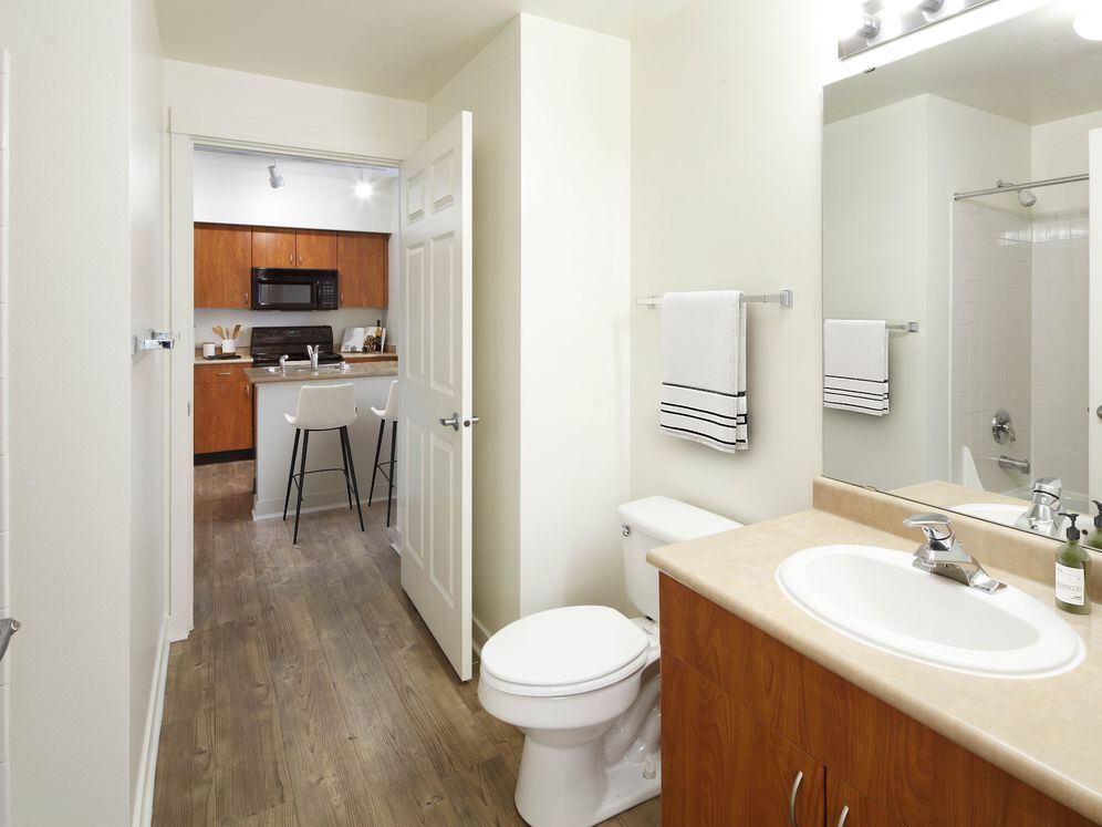 Classic Package I bath with laminate countertops, oak cabinetry, and hard surface flooring