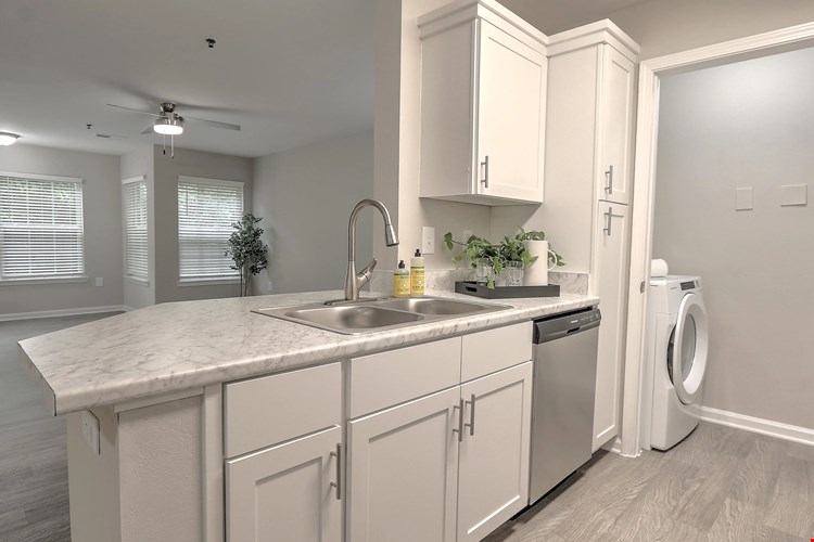 Kitchens designed for entertaining with luxury countertops and bar seating.