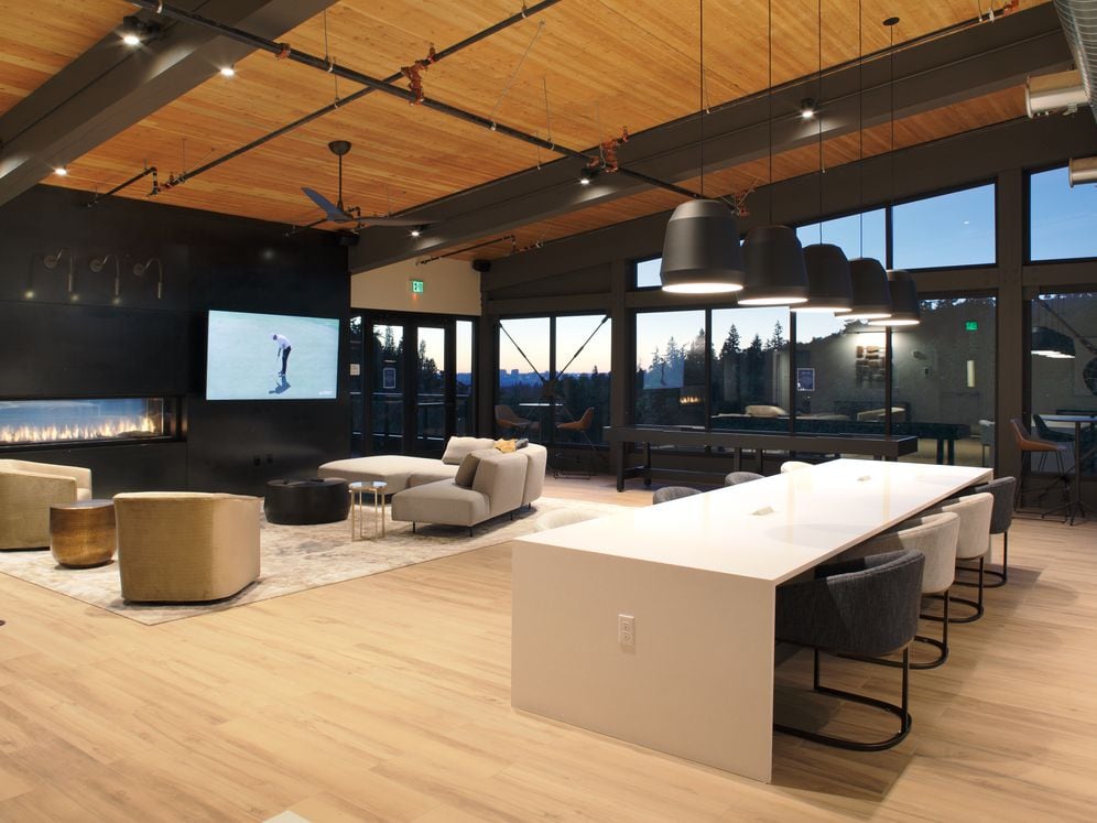 Phase II 6th Floor Lounge with multiple seating areas, fireplace, and TV