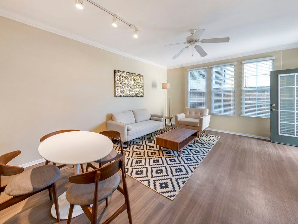 Furnished+ apartment homes include a dining set (Representative Image – exact items and style of furnishings may vary)