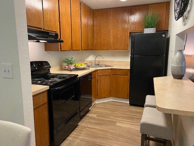 Shiny black appliances add a modern touch