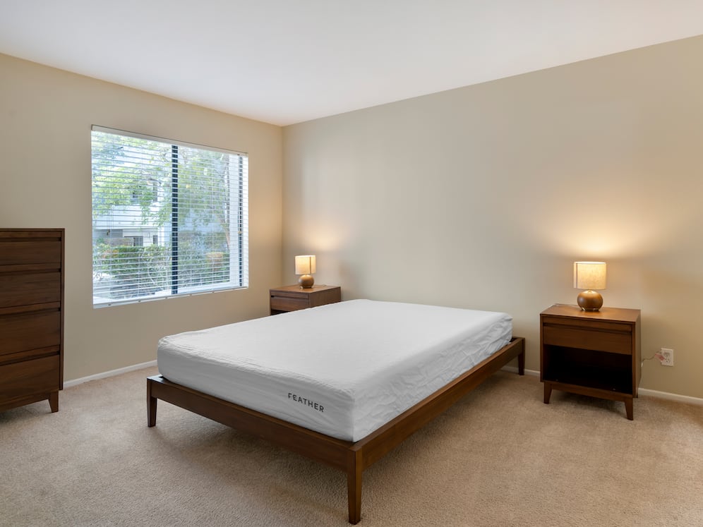 Furnished+ apartment homes feature queen bed with mattress, dresser, nightstands, and lamps.(Representative Image – exact items and style of furnishings may vary)
