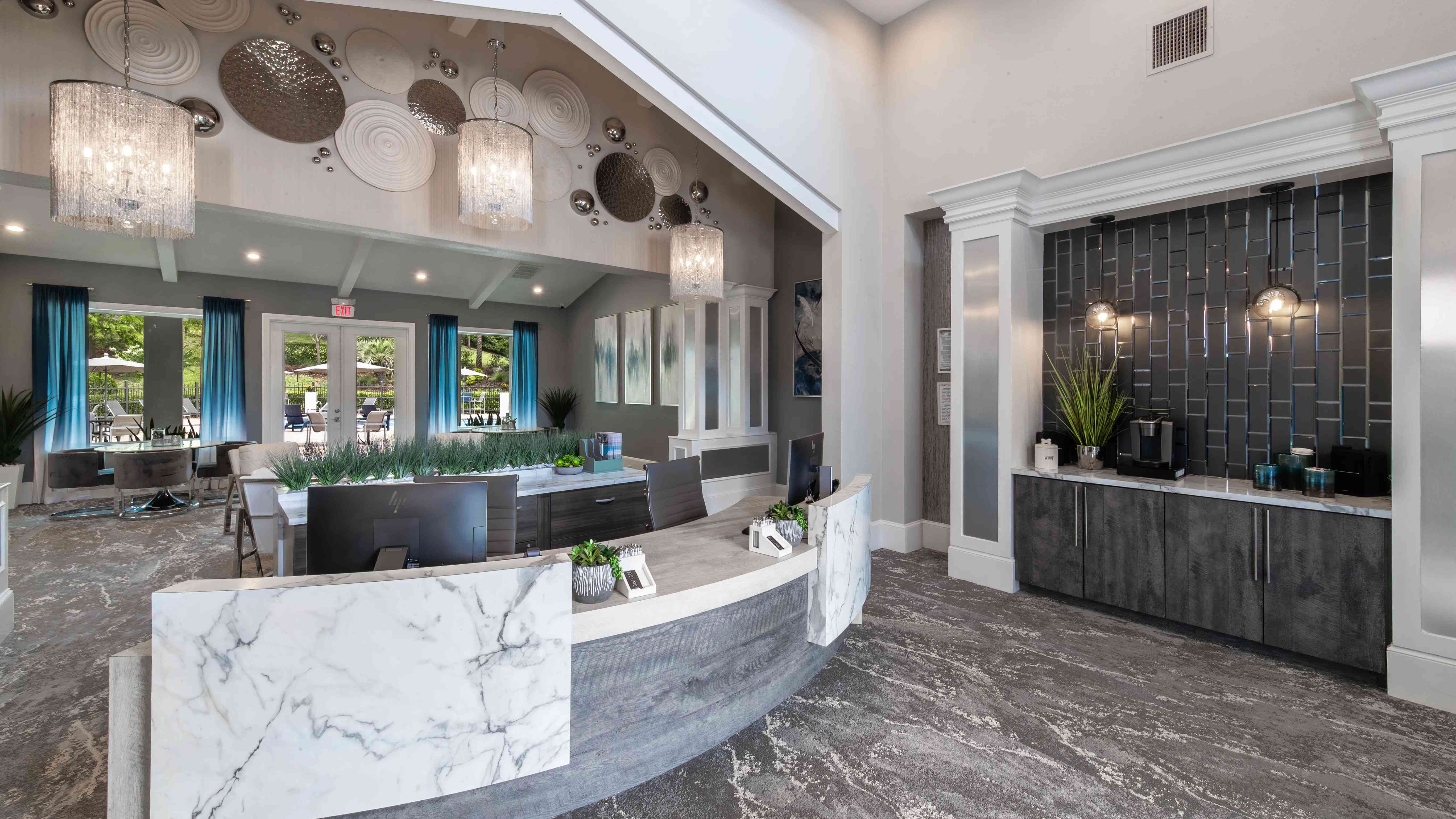 Step into our modern leasing office, where our friendly team, sleek design touches, and complimentary coffee station are ready to welcome you.